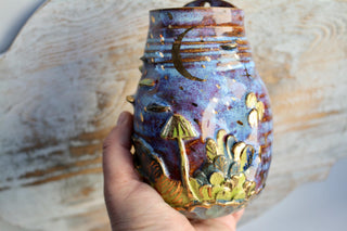 This gold-accented vase is a perfect gift for housewarmings, weddings, or anyone who appreciates one-of-a-kind ceramic art with woodland and lunar themes.